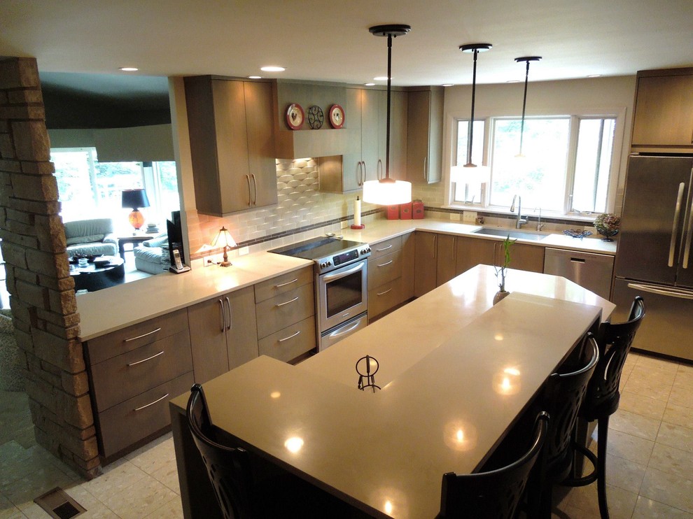Example of a large l-shaped porcelain tile open concept kitchen design with an integrated sink, flat-panel cabinets, light wood cabinets, solid surface countertops, white backsplash, ceramic backsplash, stainless steel appliances and an island