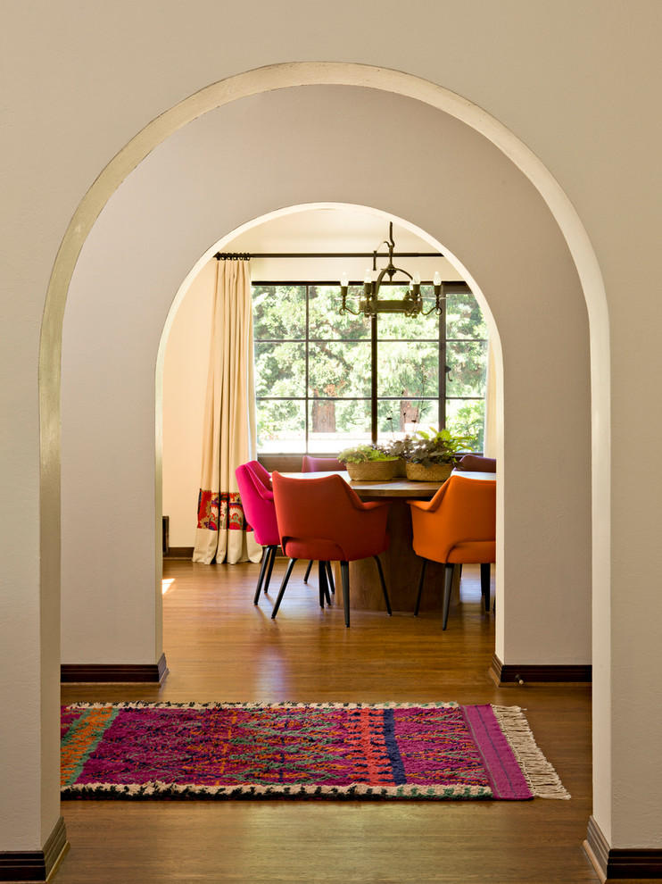 Mediterranean entryway in Portland with white walls and dark hardwood floors.