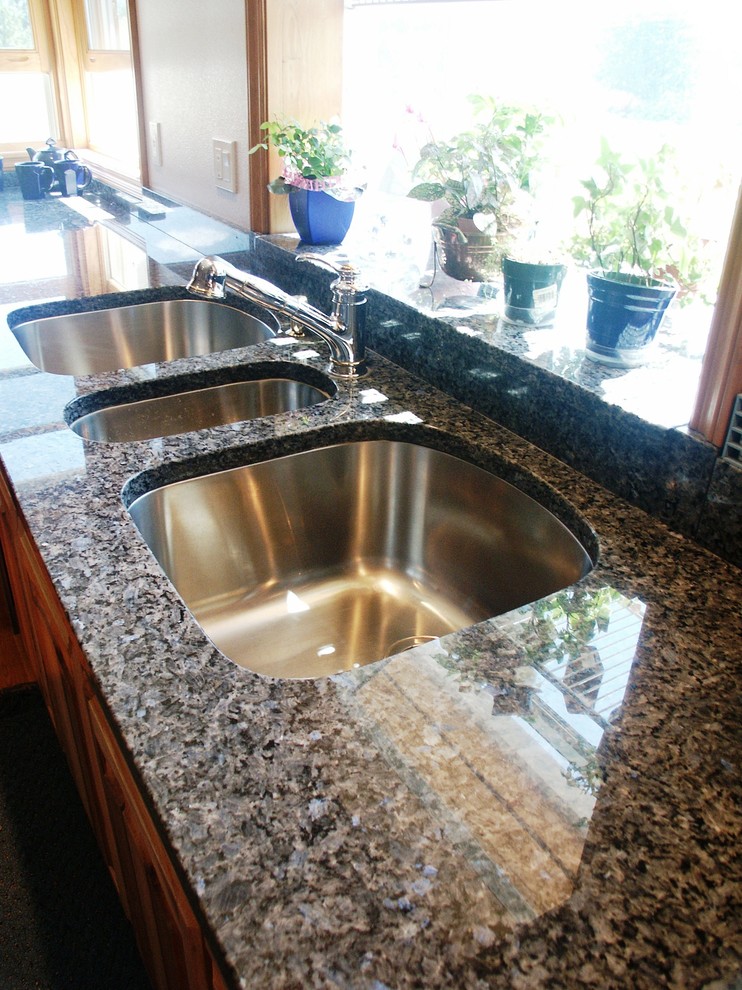 Inspiration for a transitional kitchen remodel in Seattle with an undermount sink, granite countertops and stone slab backsplash