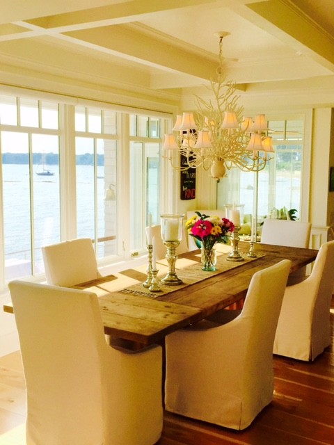 Beach style kitchen/dining combo in New York with bamboo floors.