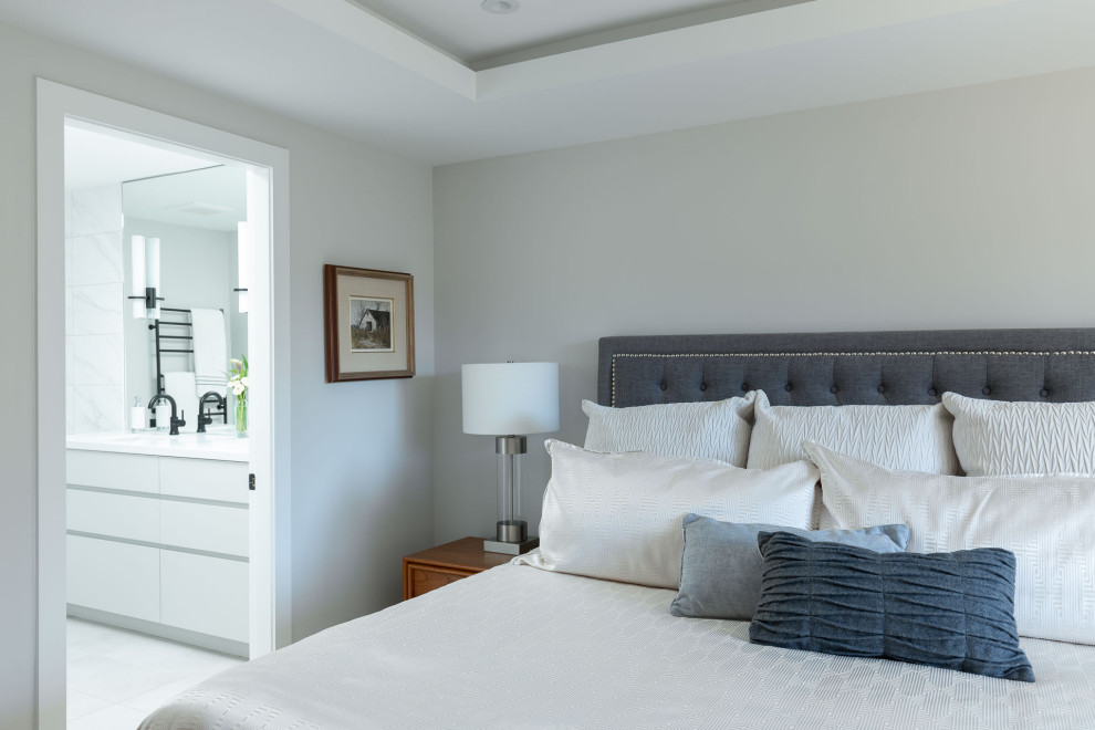 Design ideas for a transitional master bedroom in Vancouver with grey walls and coffered.