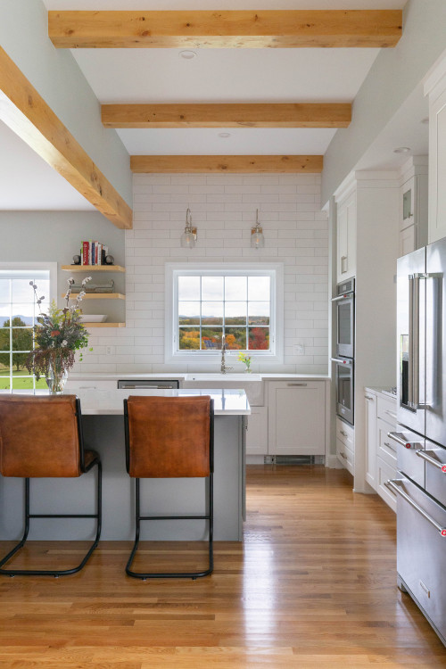 Cozy Farmhouse Kitchen Design with Gray Island in a Farmhouse White Kitchen Cabinets with White Subway Backsplash