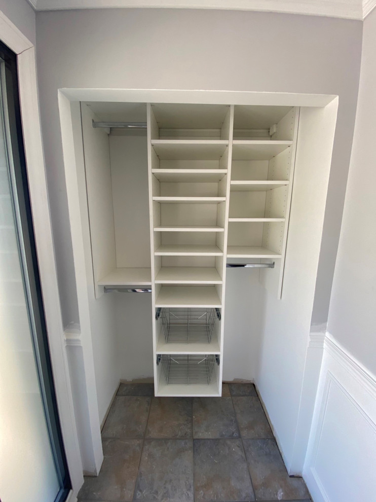 Design ideas for a small contemporary mudroom in Montreal with purple walls, limestone floors, a single front door, a black front door and grey floor.