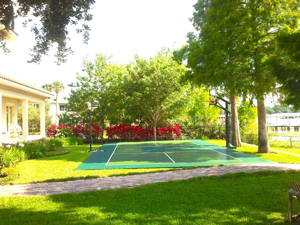 Photo of a mid-sized traditional backyard outdoor sport court in Orlando.