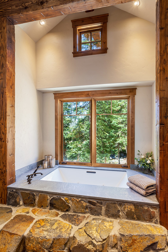 Bathroom - rustic master bathroom idea in Denver with an undermount tub and white walls