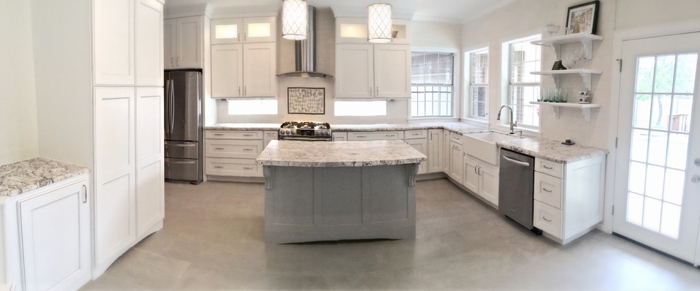 Example of a mid-sized transitional u-shaped ceramic tile eat-in kitchen design in Houston with a farmhouse sink, recessed-panel cabinets, white cabinets, granite countertops, white backsplash, stone tile backsplash, stainless steel appliances and an island
