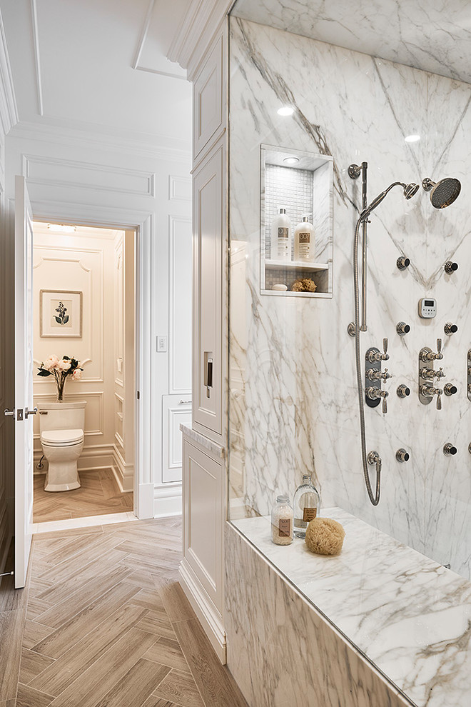 Large traditional master bathroom in Vancouver with an alcove shower, white tile, marble, white walls, ceramic floors, marble benchtops, brown floor and a one-piece toilet.