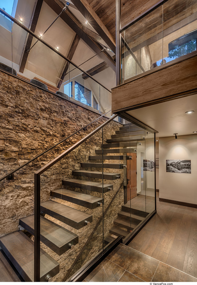 Inspiration for a country wood straight staircase in Sacramento with open risers.