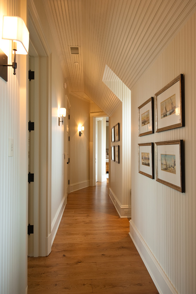 Design ideas for a traditional hallway in Charleston with white walls.