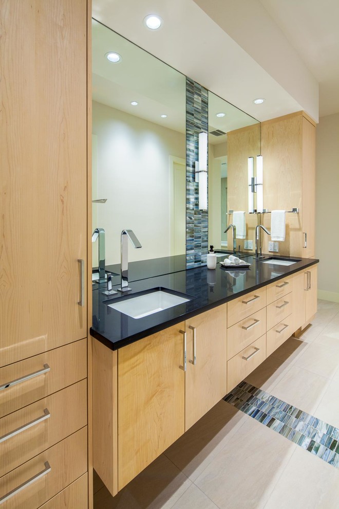 Contemporary bathroom in Austin with an undermount sink, flat-panel cabinets, light wood cabinets and beige walls.