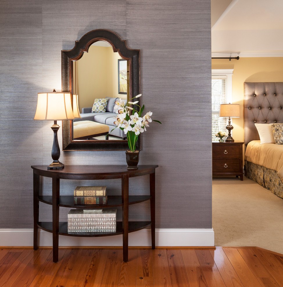Inspiration for a mid-sized transitional medium tone wood floor foyer remodel in Baltimore with metallic walls