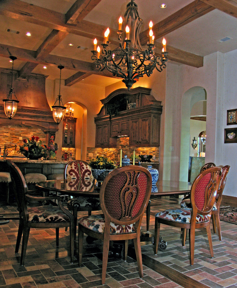 This is an example of a large traditional kitchen/dining combo in Dallas with beige walls and brick floors.