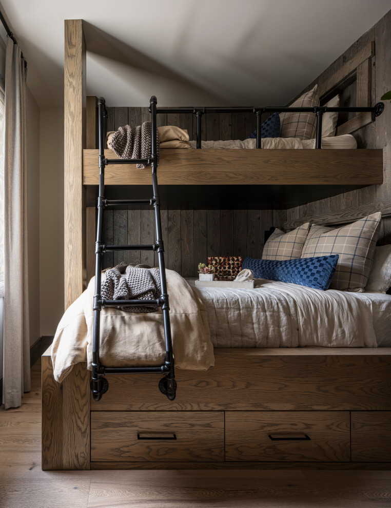 Mountain style medium tone wood floor and brown floor kids' bedroom photo in Salt Lake City with white walls
