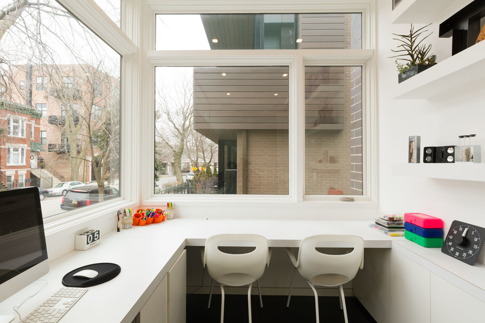 Inspiration for a small contemporary built-in desk study room remodel in Chicago with white walls