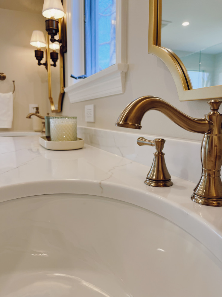 Example of a large transitional master white tile and ceramic tile travertine floor, beige floor and double-sink freestanding bathtub design with shaker cabinets, white cabinets, a two-piece toilet, beige walls, an undermount sink, quartz countertops, a hinged shower door, white countertops and a built-in vanity