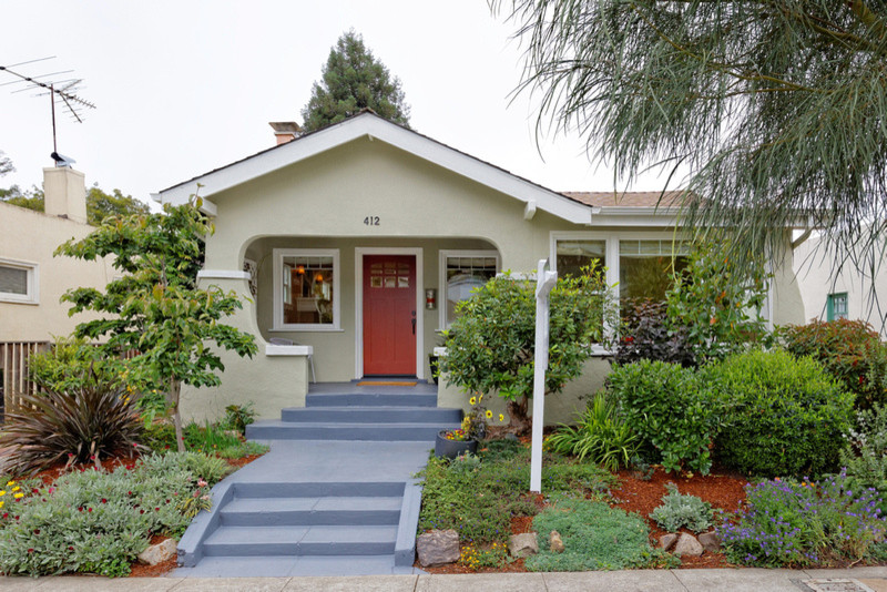 This is an example of a mid-sized transitional one-storey stucco beige exterior in San Francisco with a gable roof.