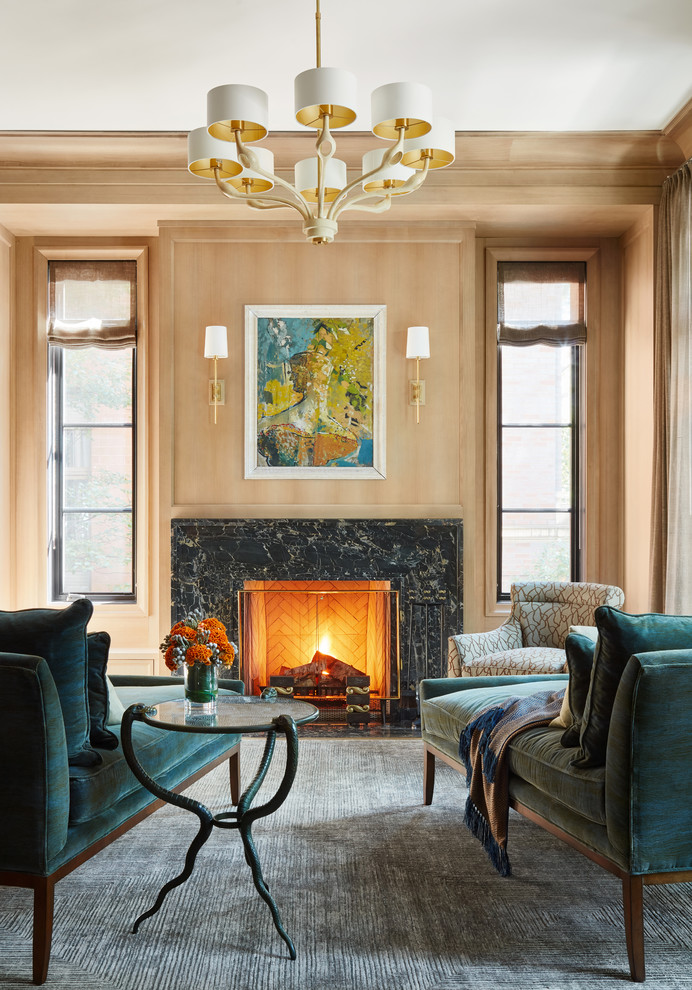 Design ideas for a traditional living room in Chicago with brown walls, a standard fireplace, a stone fireplace surround and grey floor.