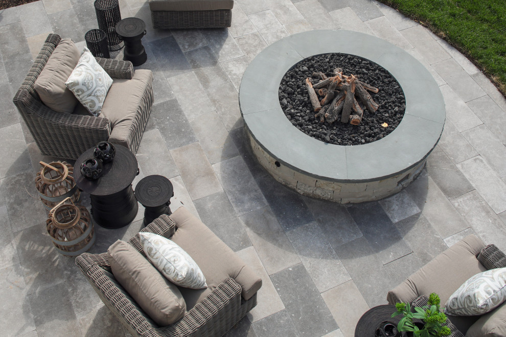 Backyard garden in Minneapolis with a fire feature and natural stone pavers.