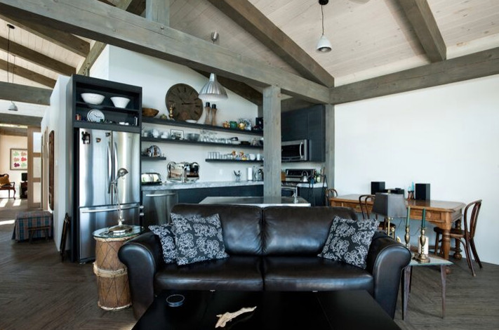 Inspiration for a large rustic light wood floor open concept kitchen remodel with an undermount sink, shaker cabinets, light wood cabinets, wood countertops, stainless steel appliances and an island