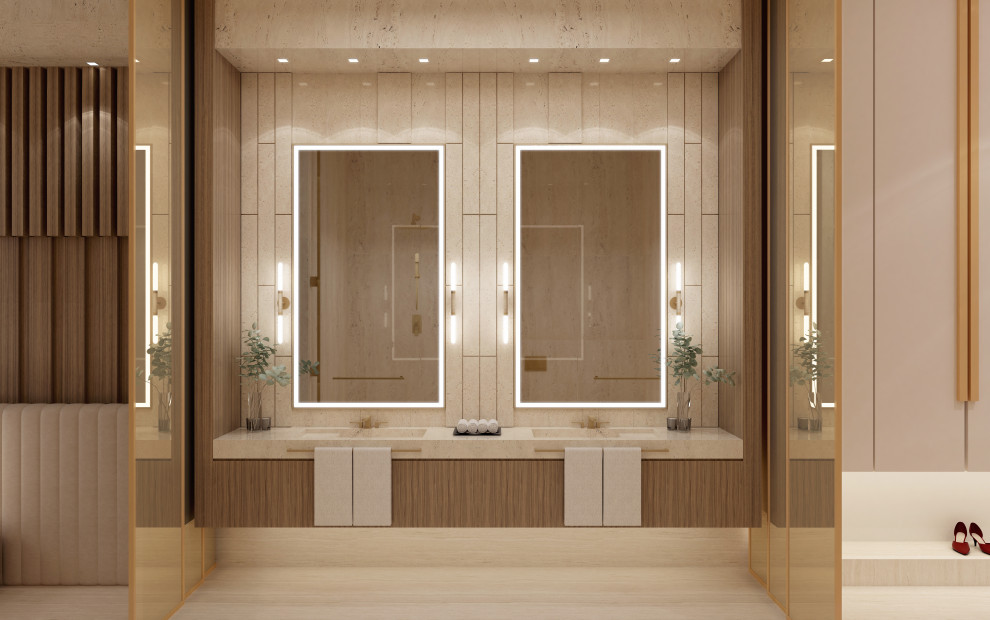 Idéer för stora funkis beige en-suite badrum, med luckor med glaspanel, beige skåp, ett fristående badkar, en dubbeldusch, en vägghängd toalettstol, beige kakel, marmorkakel, beige väggar, marmorgolv, ett integrerad handfat, marmorbänkskiva, beiget golv och dusch med gångjärnsdörr