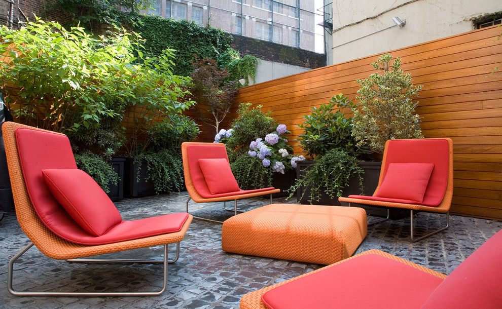 Contemporary backyard patio in New York.