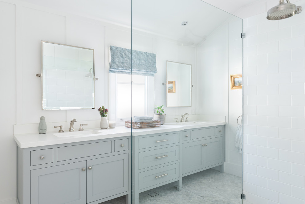 Photo of a bathroom in Perth with shaker cabinets, grey cabinets, a corner shower, white walls, mosaic tile floors, a drop-in sink, a hinged shower door, white benchtops, a double vanity and a built-in vanity.