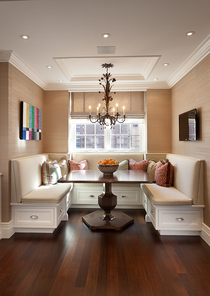 Design ideas for a traditional dining room in New York with beige walls, dark hardwood floors and brown floor.