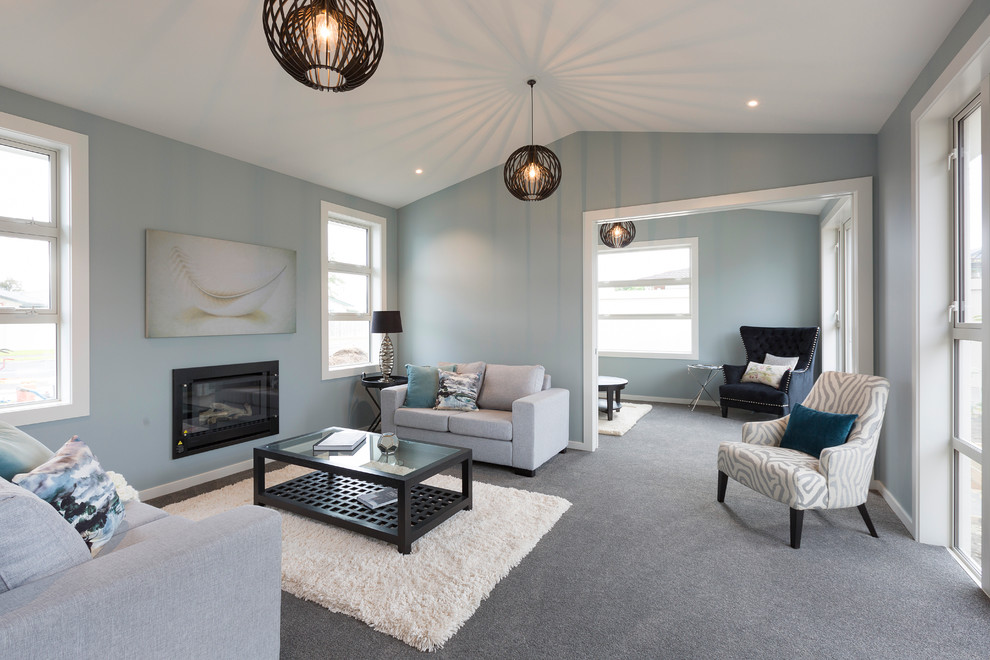 Small transitional living room in Hamilton with blue walls, carpet, a ribbon fireplace and no tv.