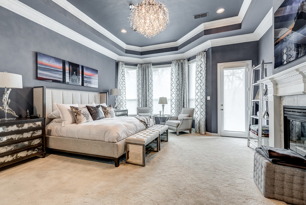 Photo of a large contemporary master bedroom in Dallas with grey walls, carpet, a standard fireplace, a tiled fireplace surround and beige floors.