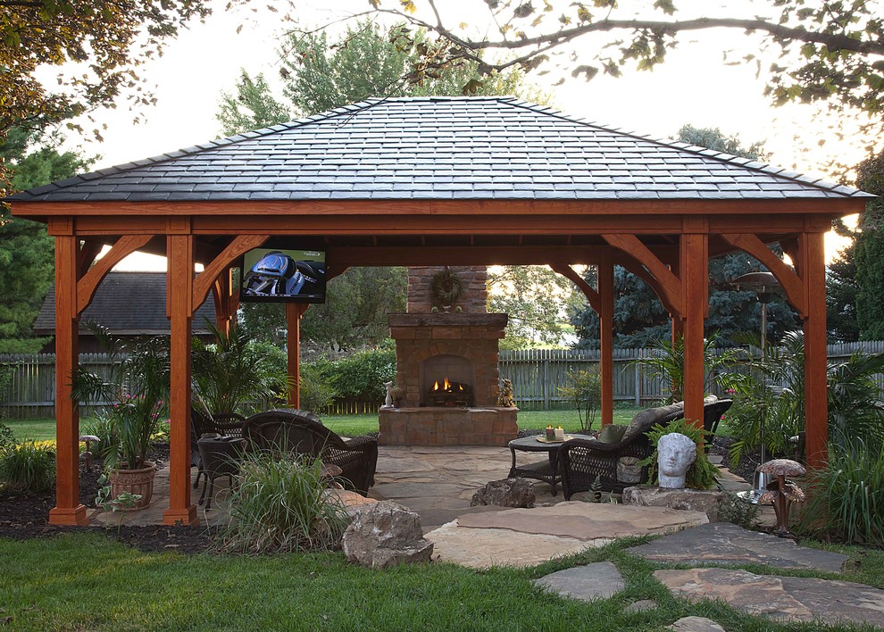 Traditional patio in Other with a fire feature and a gazebo/cabana.