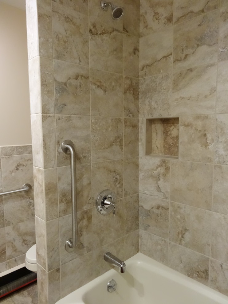 Mid-sized country 3/4 bathroom with recessed-panel cabinets, brown cabinets, an alcove tub, an alcove shower, beige tile, porcelain tile, beige walls, porcelain floors, a drop-in sink, laminate benchtops, beige floor and a shower curtain.