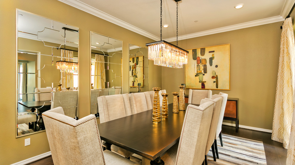 This is an example of a large arts and crafts separate dining room in Los Angeles with beige walls, dark hardwood floors, no fireplace and brown floor.