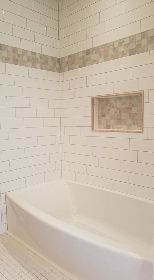 Alcove bathtub - mid-sized transitional 3/4 white tile and subway tile mosaic tile floor and white floor alcove bathtub idea with shaker cabinets, white cabinets, a two-piece toilet, beige walls, an undermount sink, solid surface countertops and white countertops