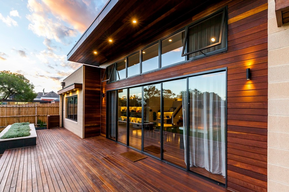 Large contemporary two-storey grey exterior in Melbourne with wood siding and a gable roof.