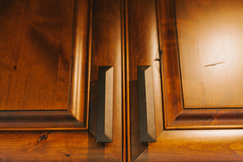 Inspiration for a transitional kitchen remodel with dark wood cabinets