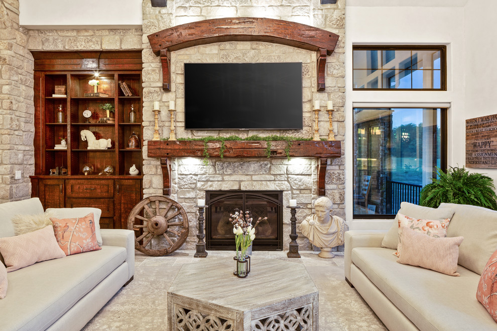 Design ideas for an expansive country formal open concept living room in Cincinnati with multi-coloured walls, travertine floors, a standard fireplace, a stone fireplace surround, a wall-mounted tv and multi-coloured floor.