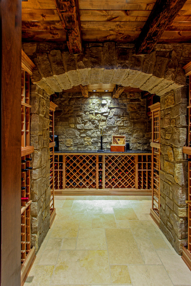 Design ideas for a traditional wine cellar in Cincinnati with travertine floors and storage racks.