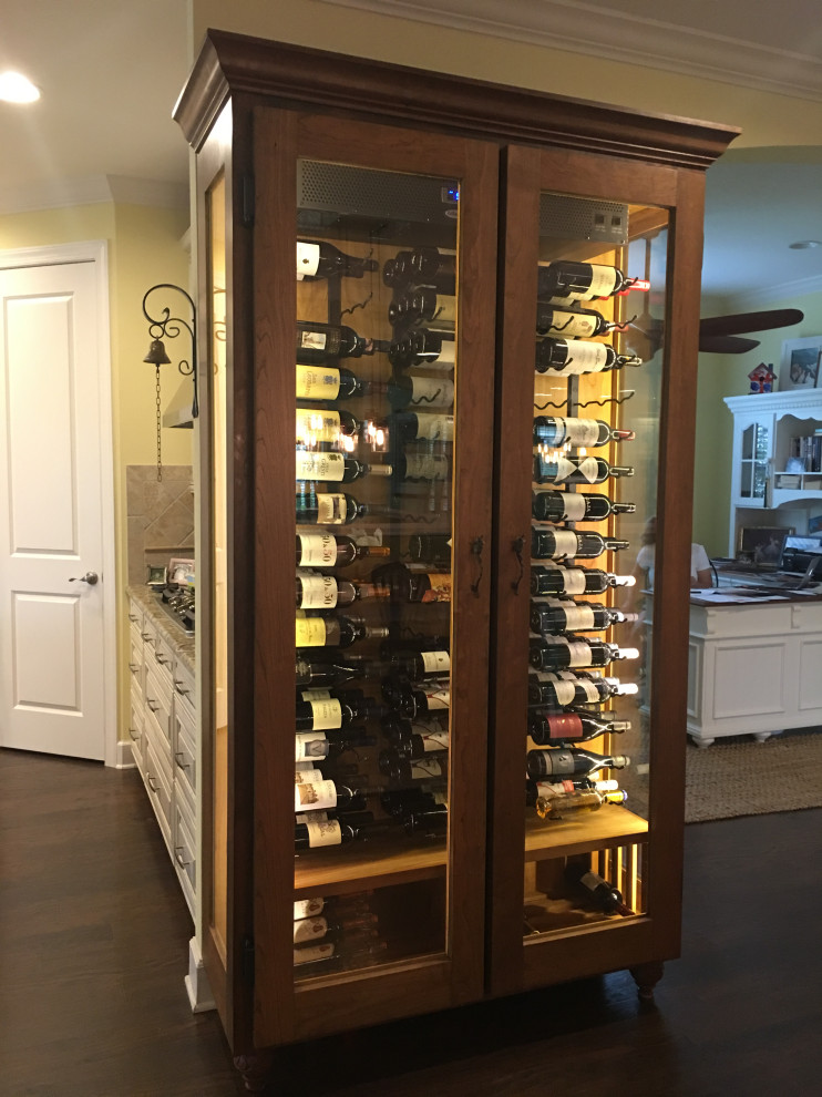 Photo of a mid-sized traditional wine cellar in Tampa with display racks.