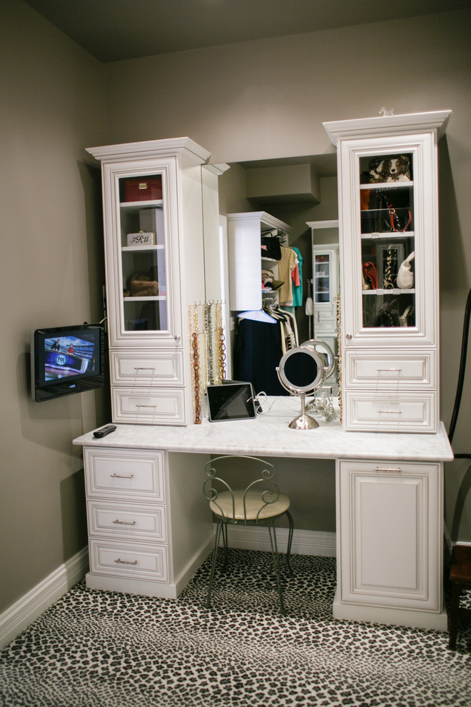 Design ideas for a large traditional gender-neutral dressing room in Atlanta with raised-panel cabinets, white cabinets, carpet and multi-coloured floor.