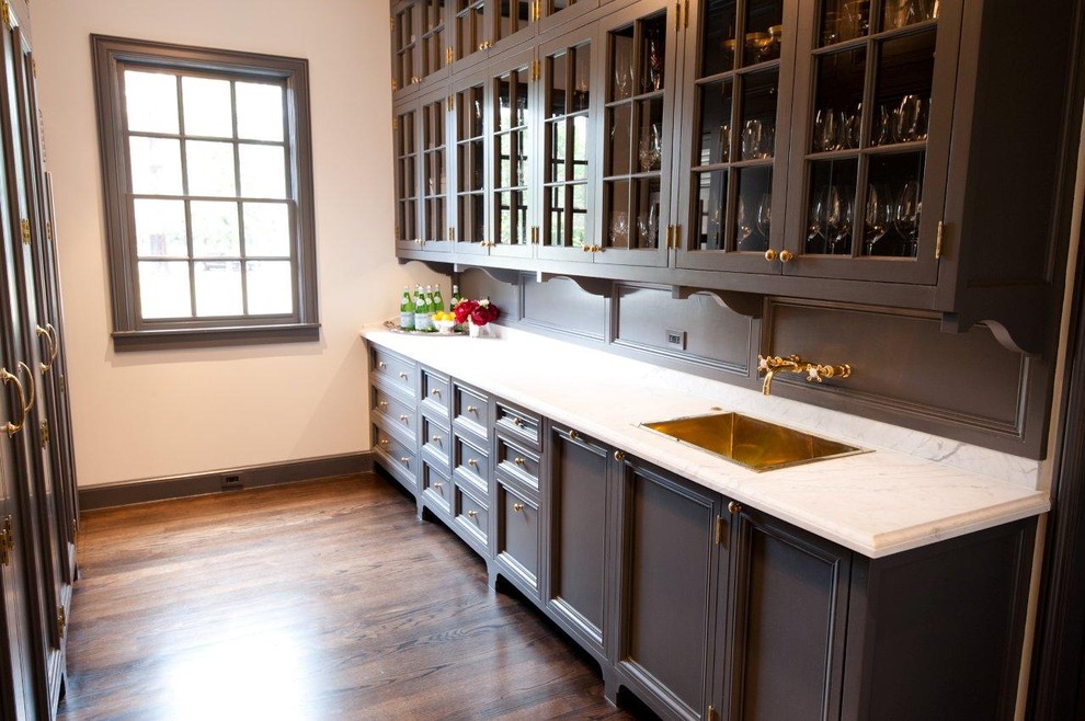 Example of a classic kitchen design in Houston with glass-front cabinets, a single-bowl sink and gray cabinets
