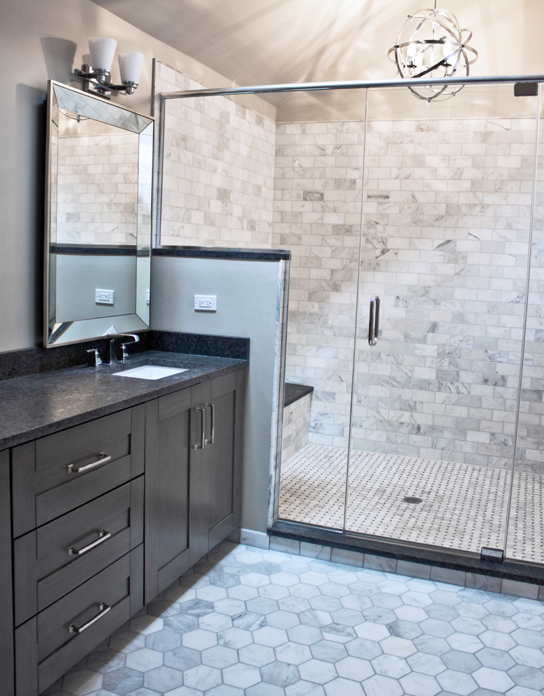 Mid-sized transitional master gray tile and marble tile marble floor and gray floor doorless shower photo with shaker cabinets, dark wood cabinets, a one-piece toilet, gray walls, an undermount sink, granite countertops and a hinged shower door