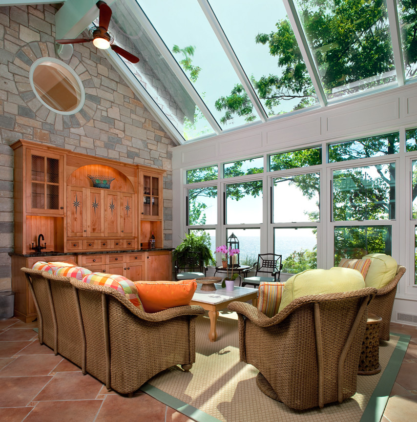 Design ideas for a large eclectic sunroom in Grand Rapids with a glass ceiling.