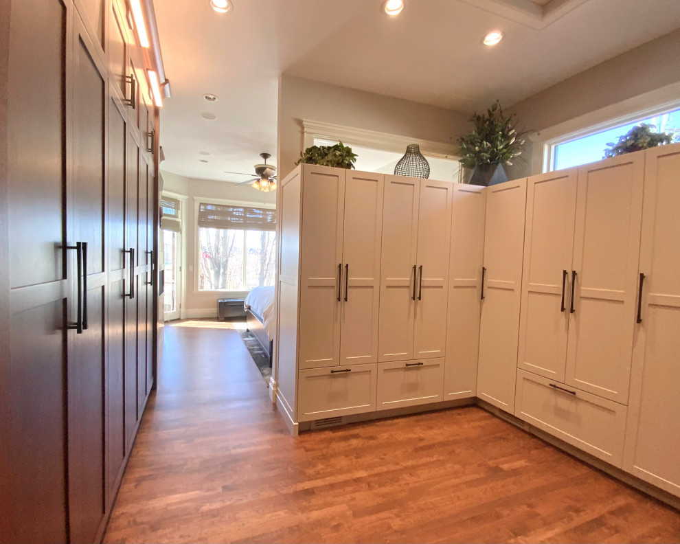 Mid-sized transitional master dark wood floor and brown floor bedroom photo in Calgary with gray walls