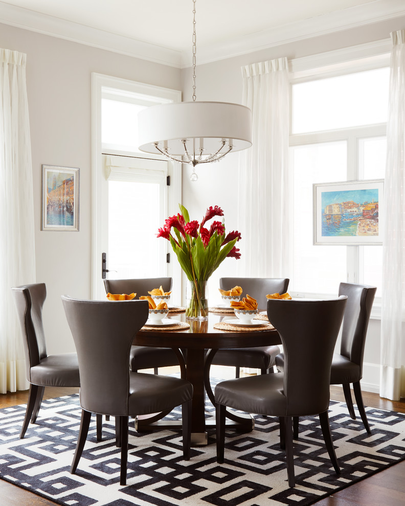 Photo of a large transitional separate dining room in Chicago with dark hardwood floors, brown floor and no fireplace.