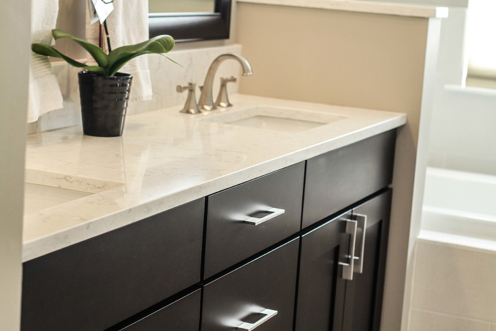 Design ideas for a large contemporary master bathroom in Philadelphia with shaker cabinets, dark wood cabinets, a drop-in tub, an undermount sink, engineered quartz benchtops, gray tile and grey walls.