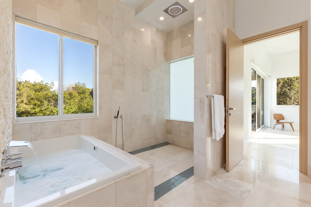 Large contemporary master wet room bathroom in Tampa with flat-panel cabinets, white cabinets, a japanese tub, a one-piece toilet, beige tile, white walls, travertine floors, an undermount sink, marble benchtops, beige floor, an open shower and travertine.