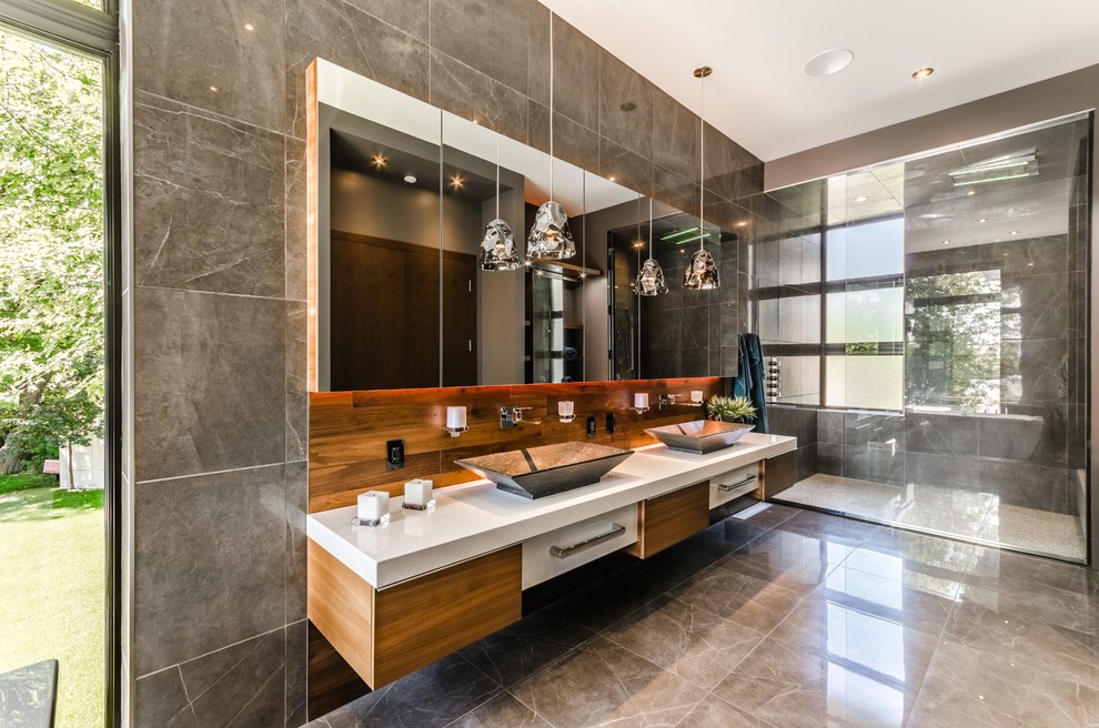 This is an example of a contemporary master bathroom in Vancouver with flat-panel cabinets, white cabinets, an alcove shower, gray tile, a vessel sink and grey floor.