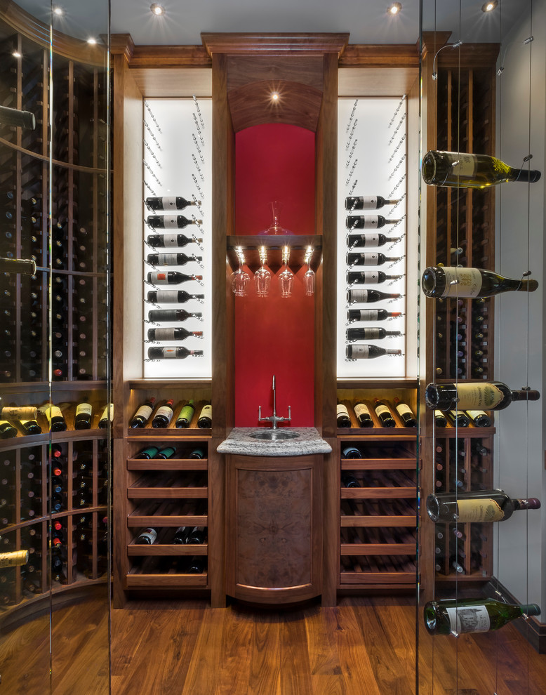 Transitional wine cellar in Phoenix with medium hardwood floors and storage racks.