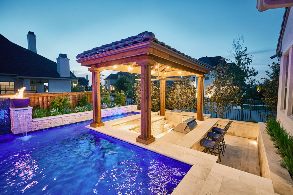 Design ideas for a modern custom shaped swimming pool in Dallas with natural stone paving.