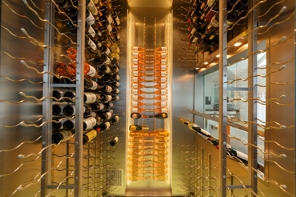 Mid-sized contemporary wine cellar in New York with marble floors and display racks.